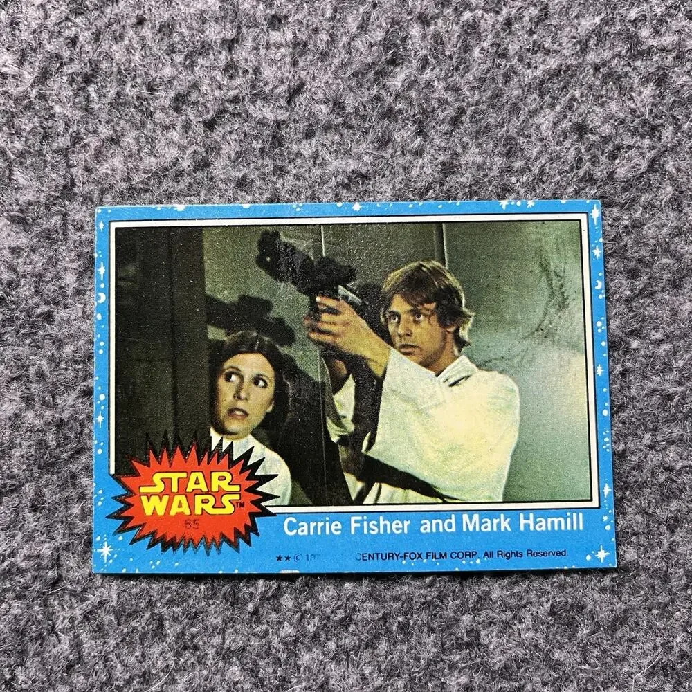 Carrie Fisher and Mark Hamill 1977 Topps Star Wars Card TCG #65